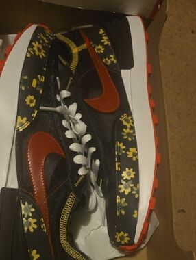 Nike Black Floral Runner with Red Swoosh and Yellow Accents